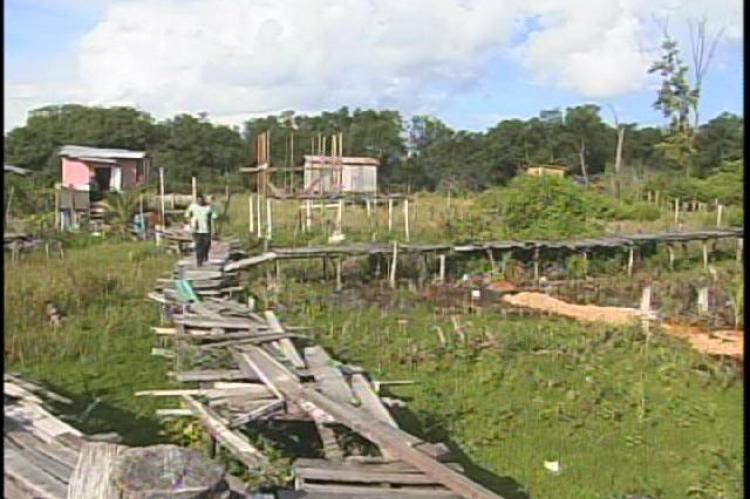 Housing over London Bridges on South side Belize City