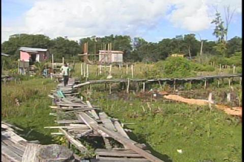 Housing over London Bridges on South side Belize City