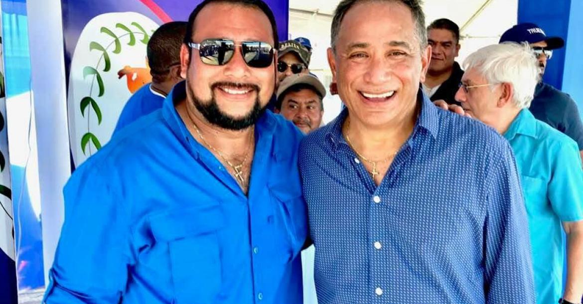 Former Minister of Agriculture, Jose Abelardo Mai seen With Prime Minister, John Briceno and PUP Clan in the background.